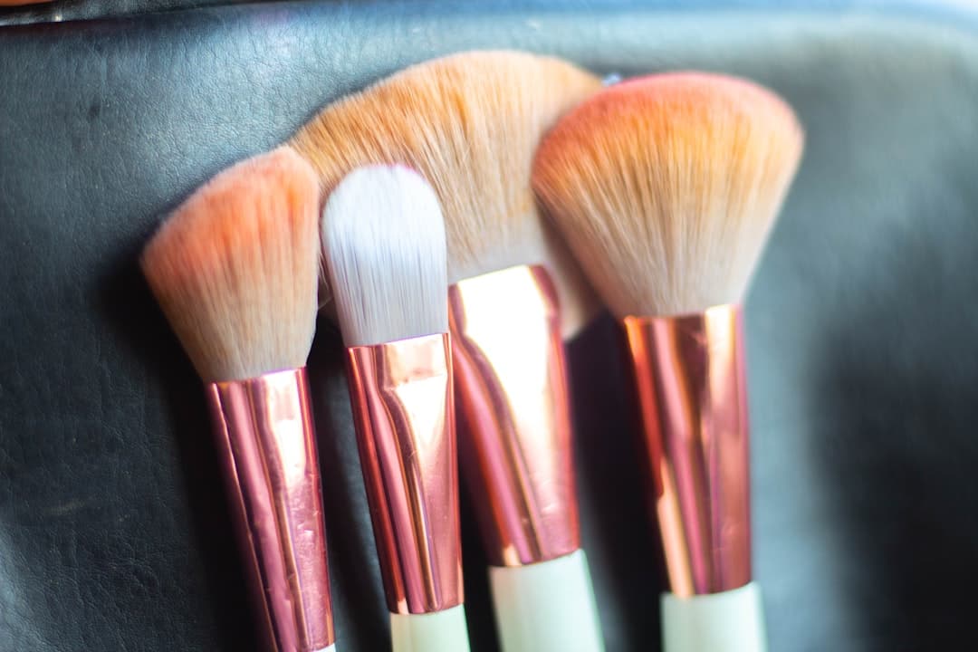 Blush compacts side by side on textured linen surface